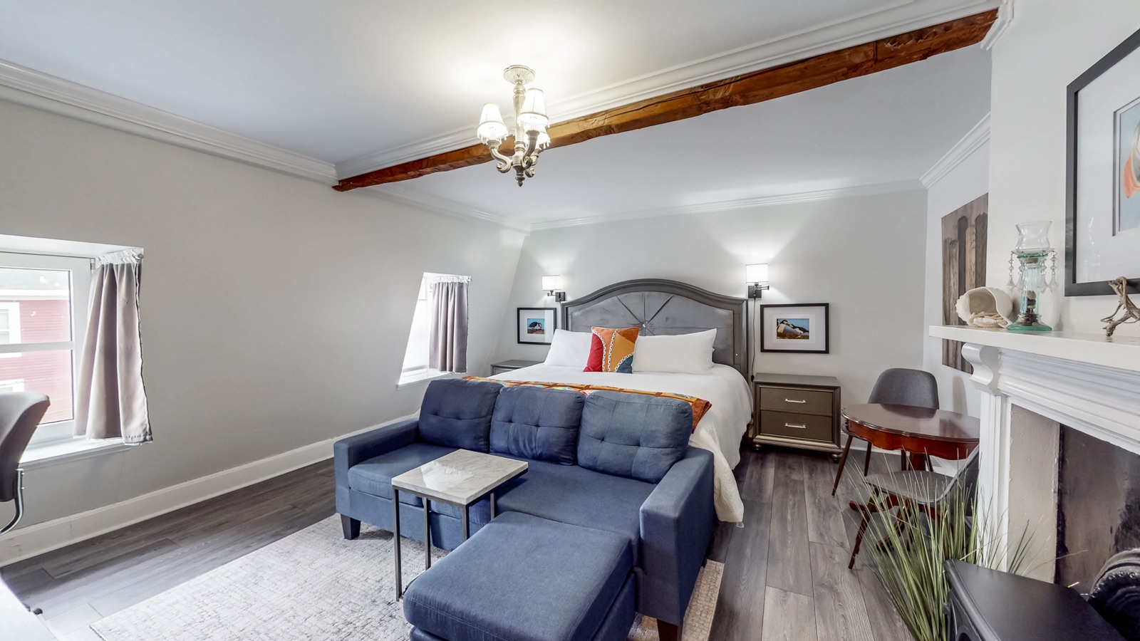 Top-floor primary retreat with sitting area and fireplace